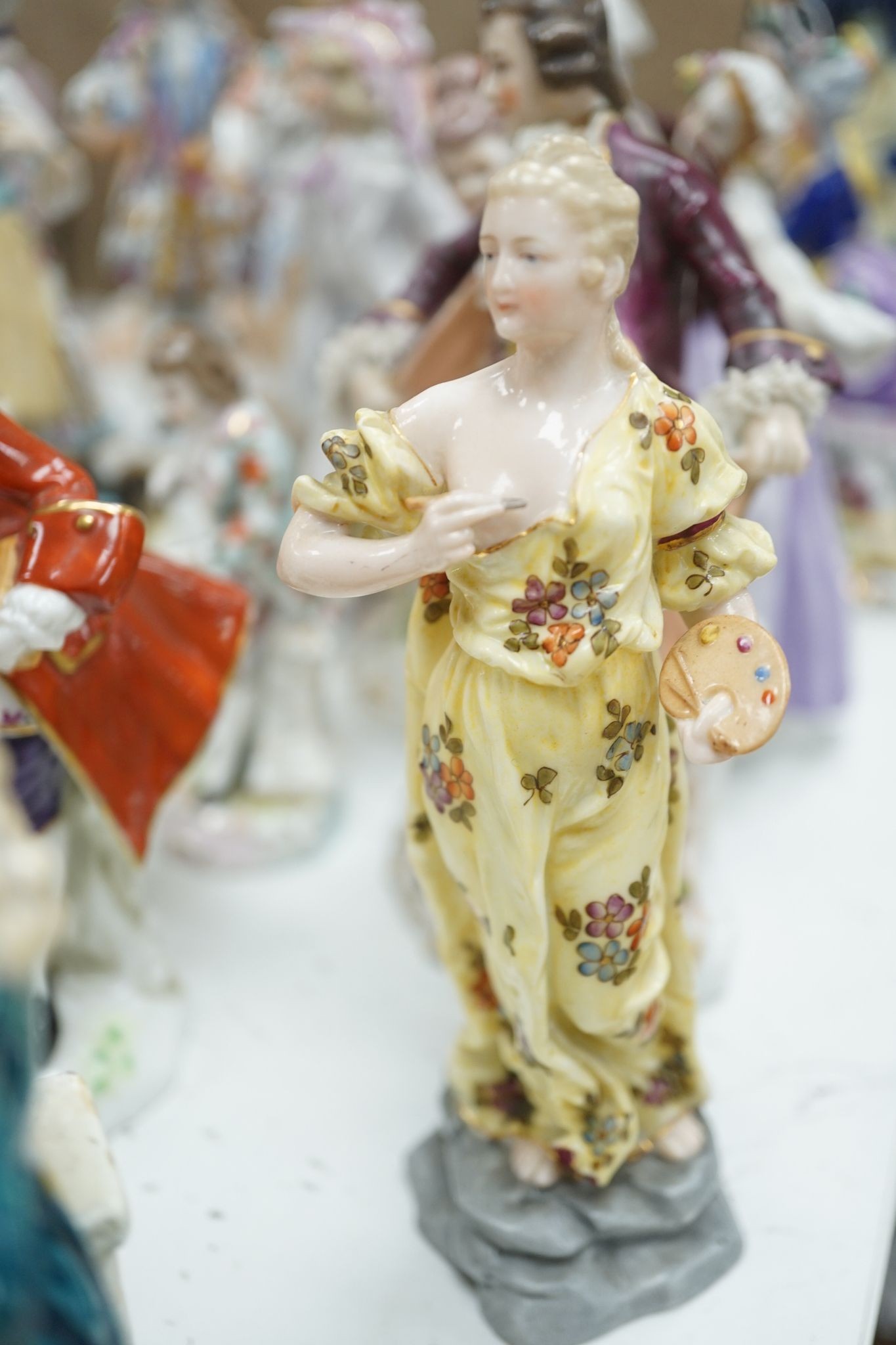 A large collection of small to medium German, French and English porcelain figurines and groups, tallest 18cm